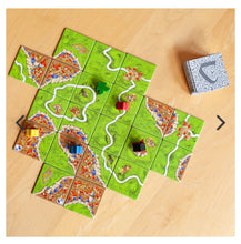Load image into Gallery viewer, Board game with a map layout on a wooden surface