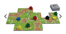 Load image into Gallery viewer, Colorful pieces on green tiles
