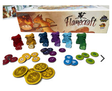 Load image into Gallery viewer, Board game components including figures and tokens with 'Flamecraft' box in the background
